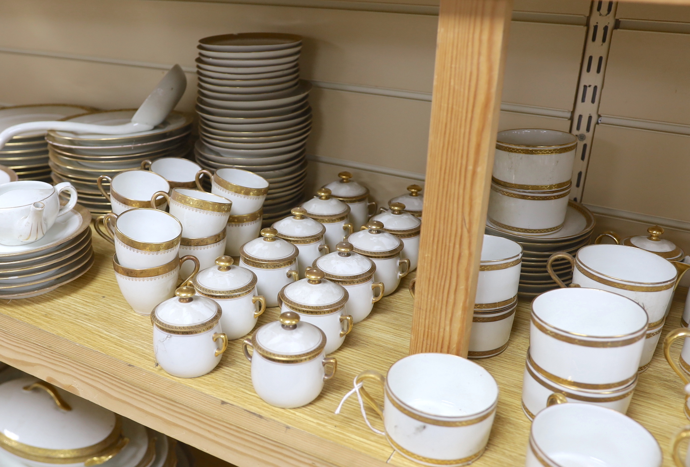 Three French Limoges gilt banded part dinner and tea services including cups, plates and jars & covers